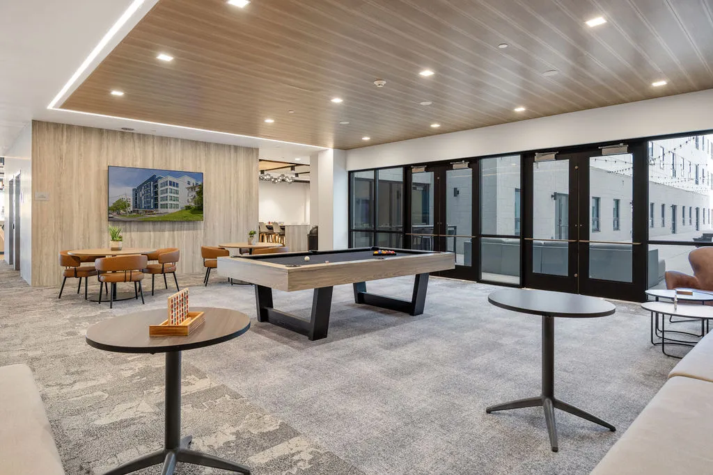 community space with pool tale and games