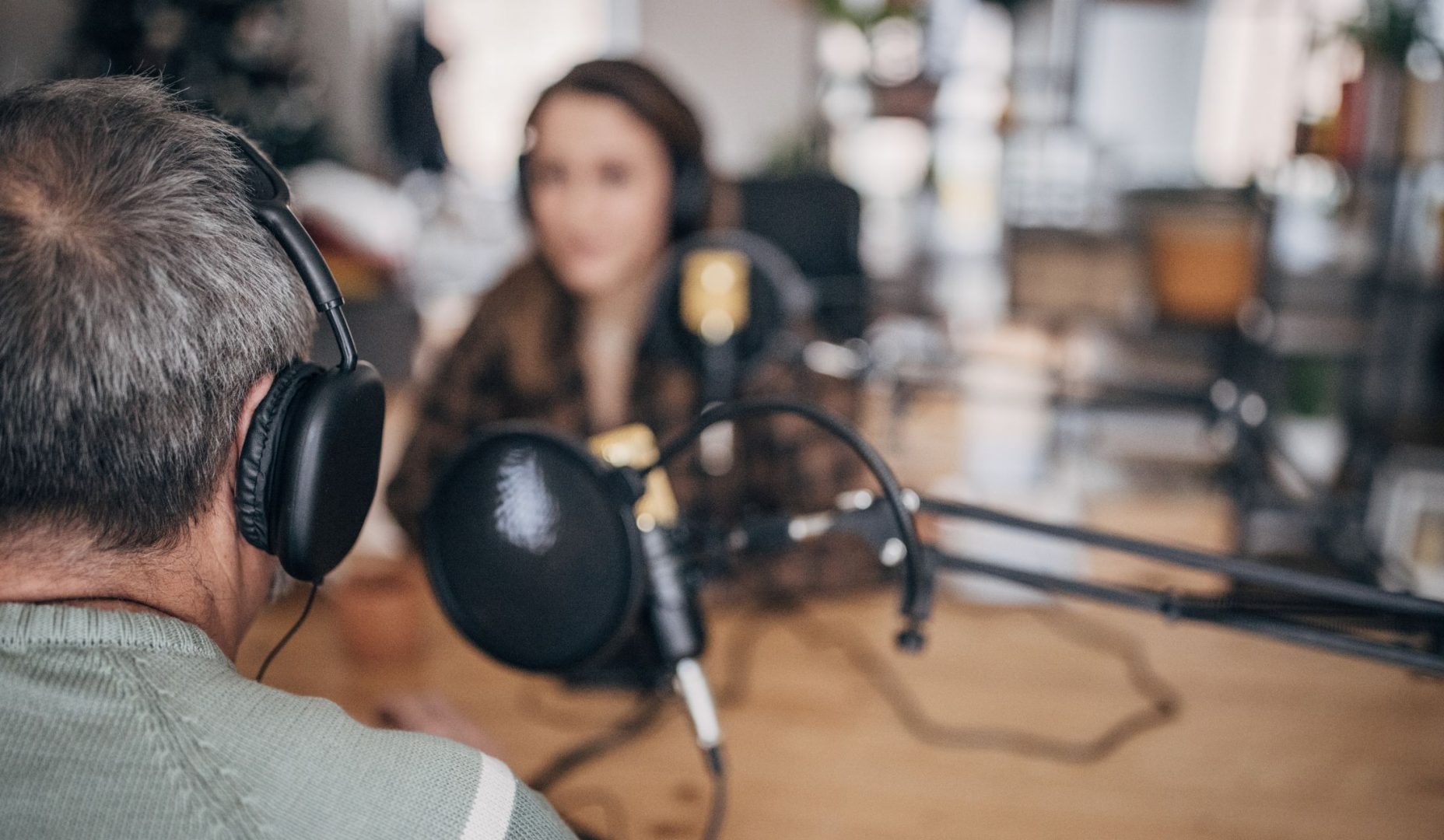 two people participating in a podcast